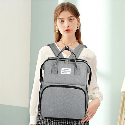 Multifunctional baby changing backpack with portable cot and insulated pockets