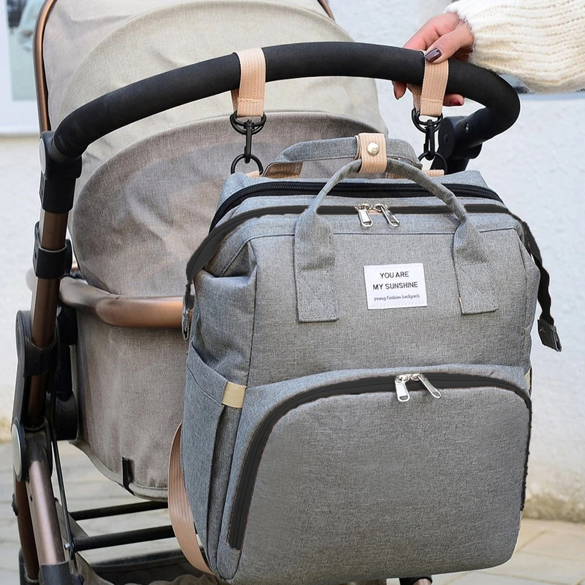 Multifunctional baby changing backpack with portable cot and insulated pockets