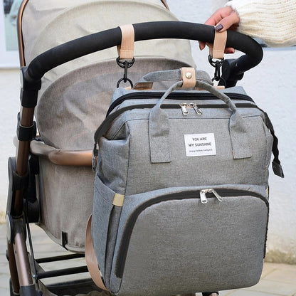 Multifunctional baby changing backpack with portable cot and insulated pockets