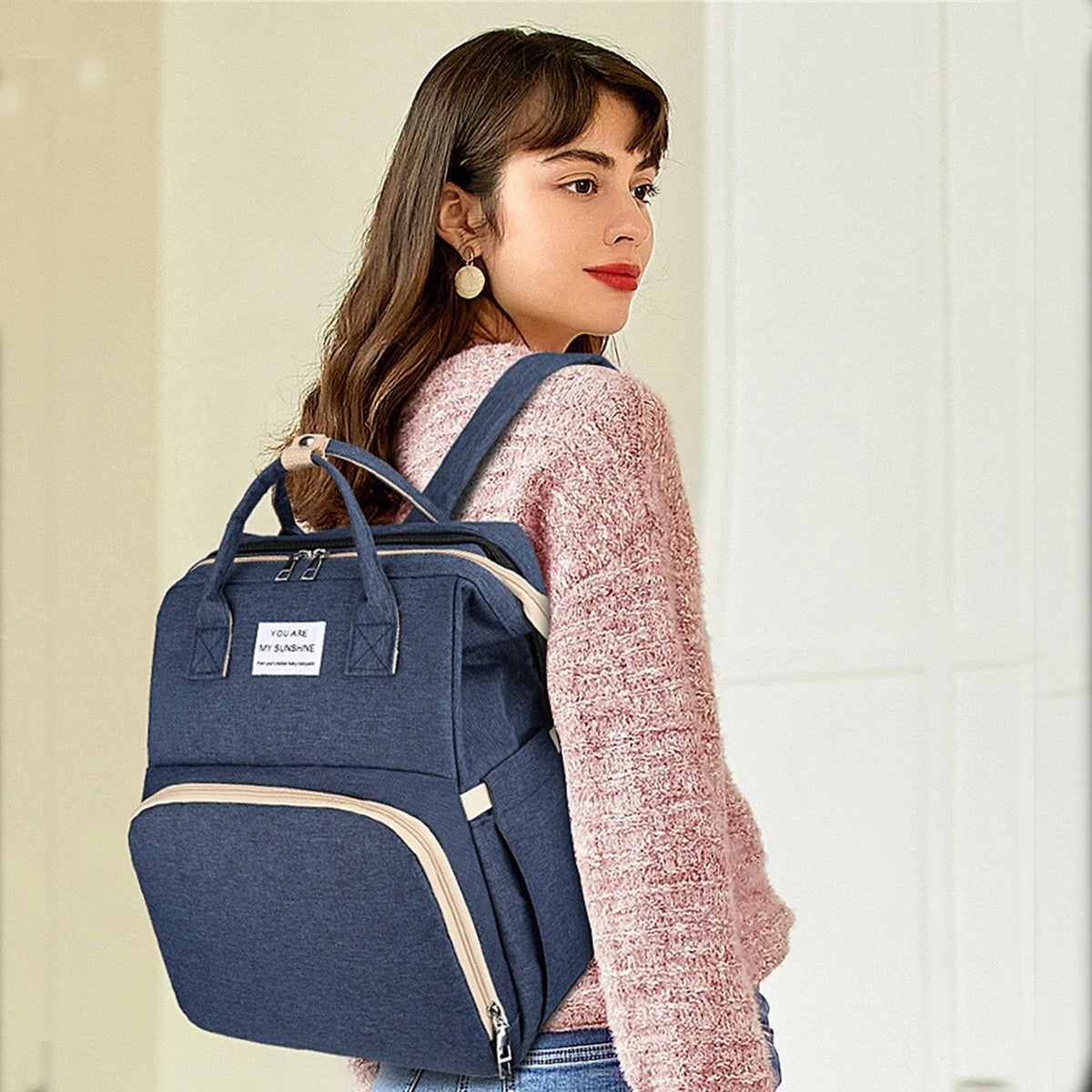 Multifunctional baby changing backpack with portable cot and insulated pockets