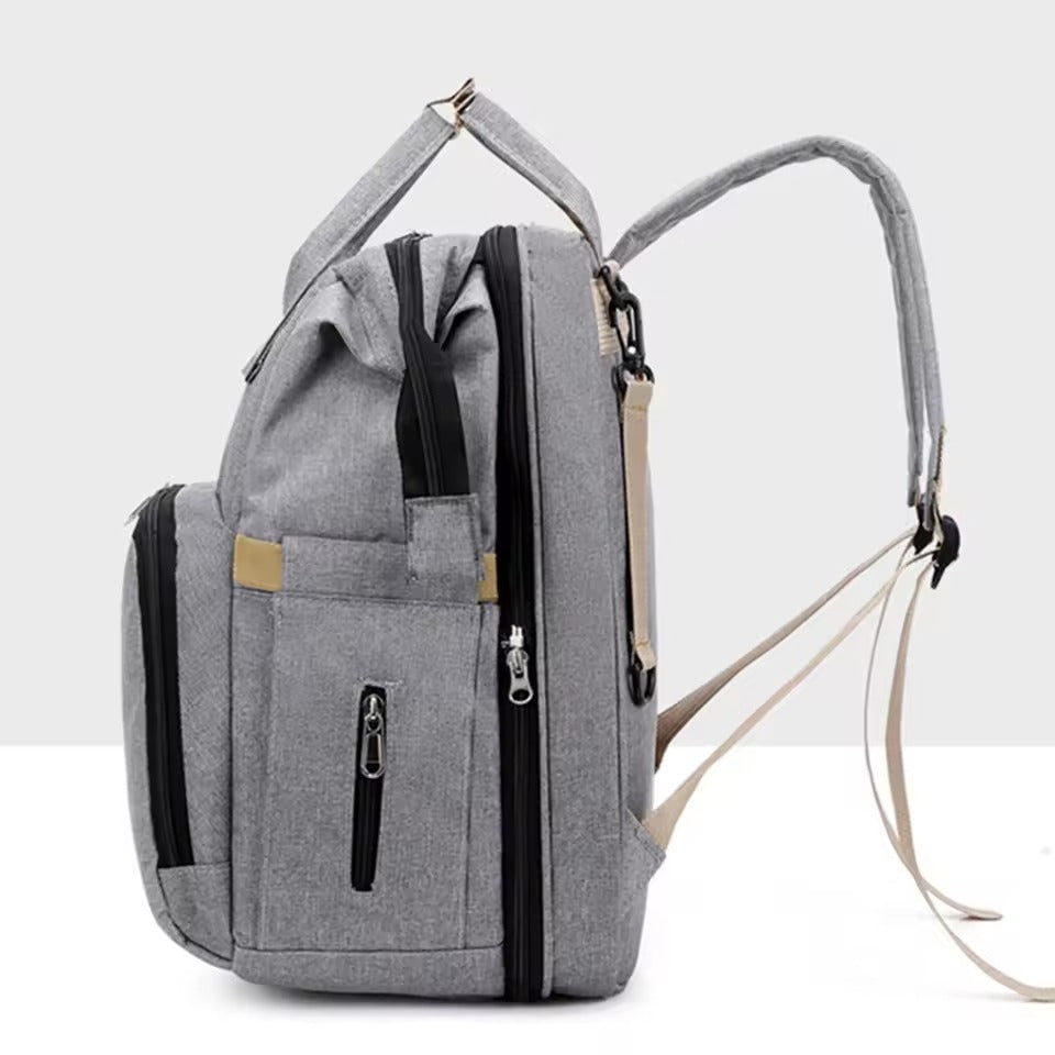 Multifunctional baby changing backpack with portable cot and insulated pockets