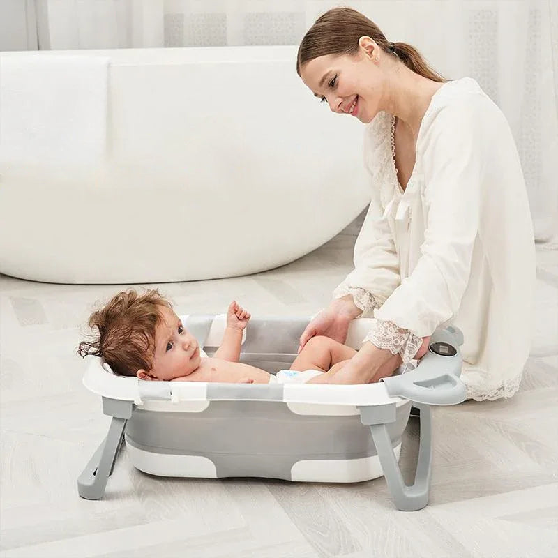 Foldable baby bath with ergonomic bath mat and digital thermometer